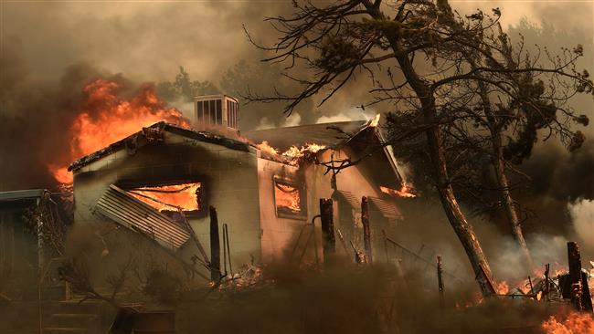 آمریکا در آتش و سیل؛ 26 کشته (+عکس و فیلم)