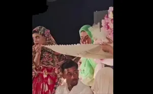 مراسم ازدواج زوج مینابی در جوار مزار شهدای مدرسه شجره طیبه