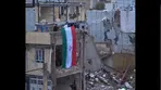 اهتزاز پرچم مقدس ایران در خانه‌ای که در خرم‌‌آباد موشک‌باران شد